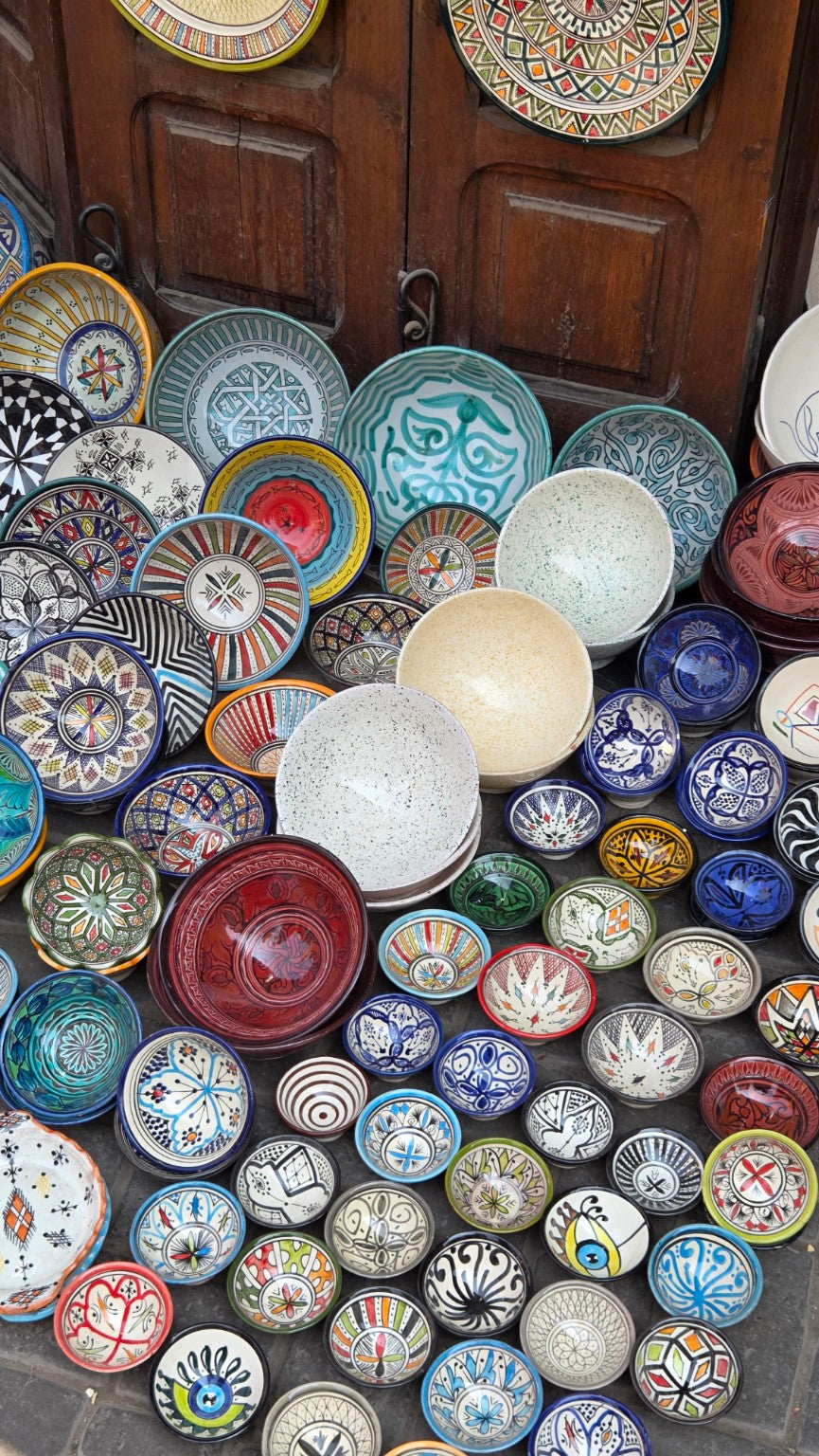 Hand-painted ceramic bowls in a Moroccan market